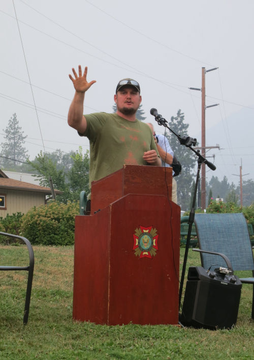 Mike Oxendine speaking while standing behind a podium